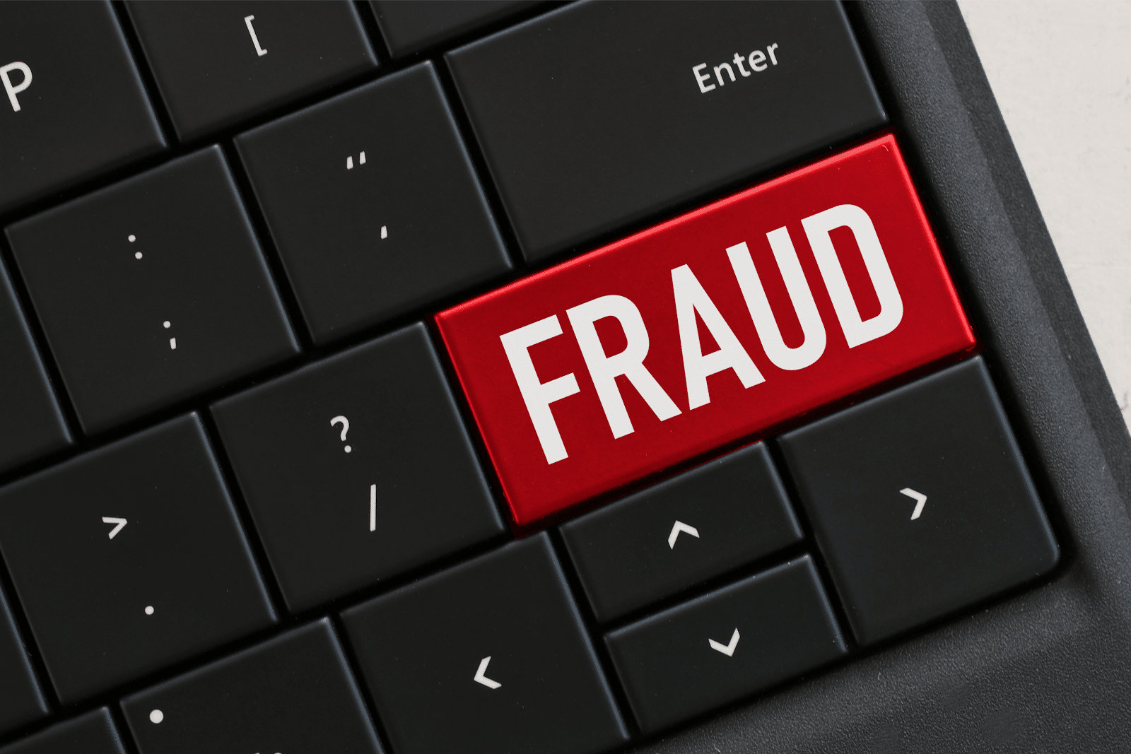 Red key on a laptop keyboard that says "fraud" (accounts payable fraud)