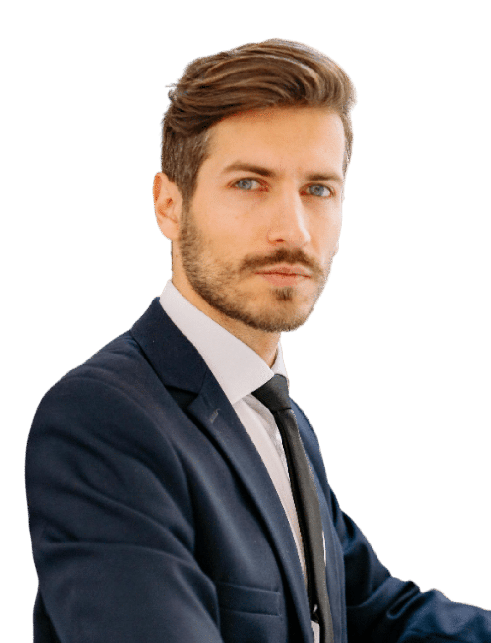A man with short brown hair and a trimmed beard, dressed in a dark suit, white shirt, and black tie, looks confidently at the camera against a plain white background.