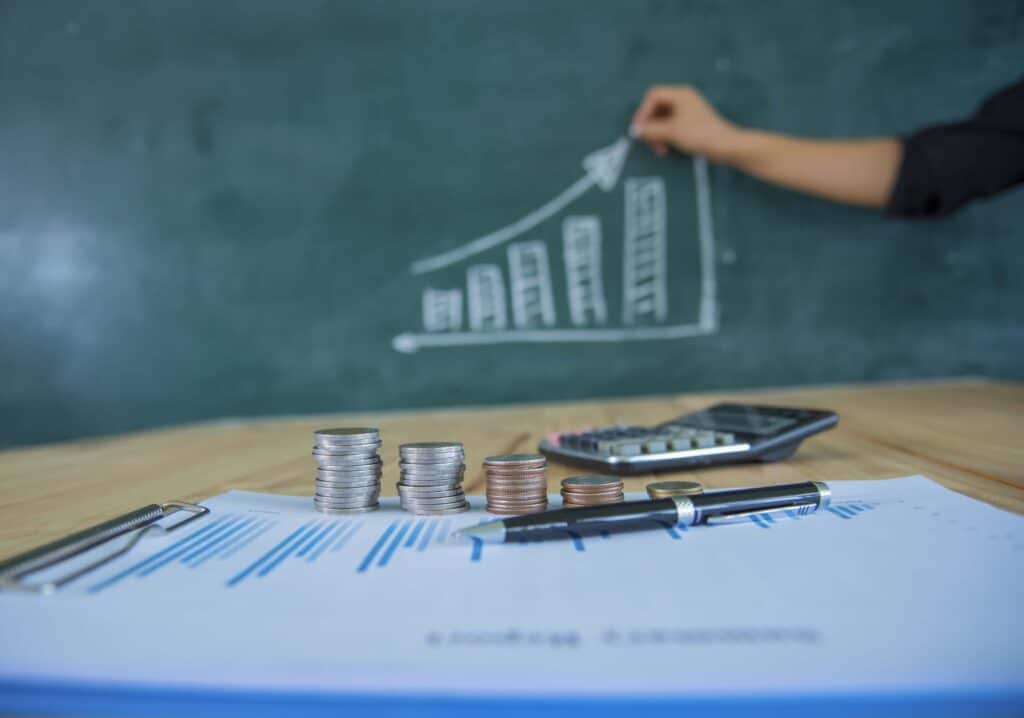 cash flow and project profitability concept with stacked coins and upward financial chart